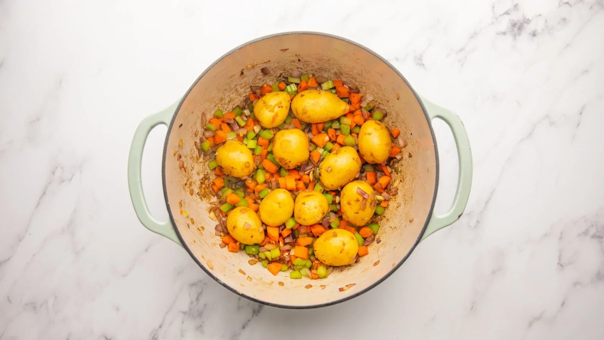 add the chopped vegetables and baby potatoes to the pot