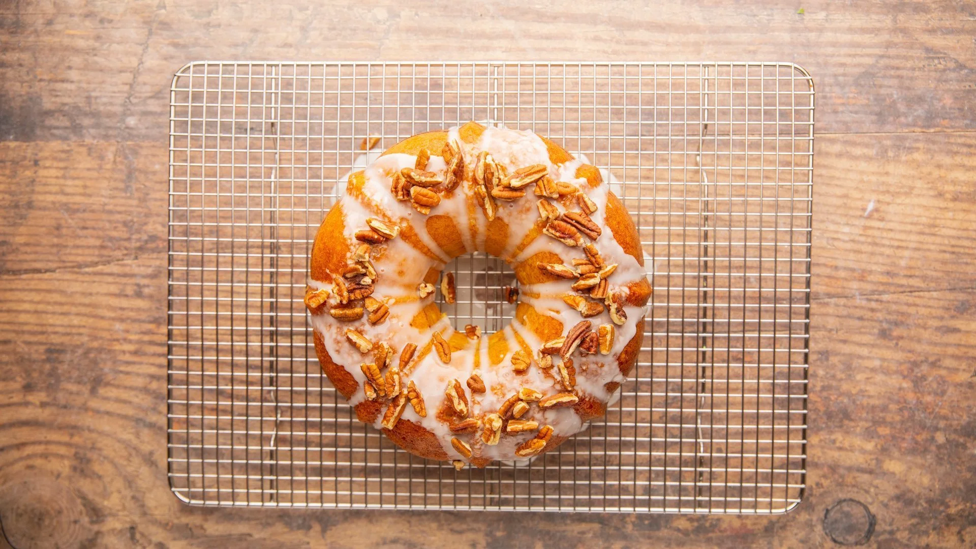 Turn the sock it to me cake upside down onto a plate and drizzle the glaze over the cooled cake.