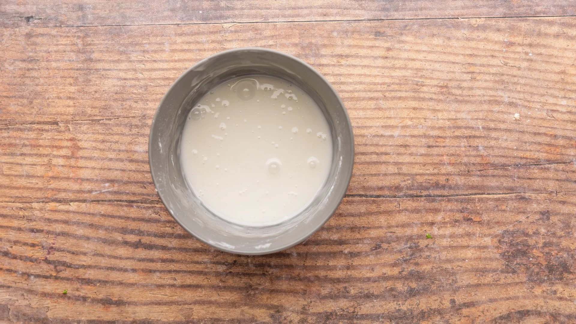 Whisk the confectioner's sugar and milk in a small bowl until smooth and runny