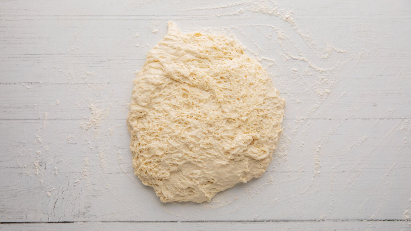 Turn it out onto a lightly floured surface and cut the dough in half.