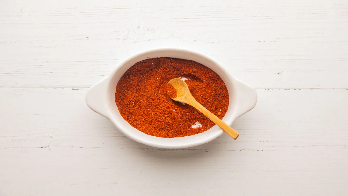 Mix the cayenne pepper, paprika, chili powder, and a pinch of salt in a small bowl.