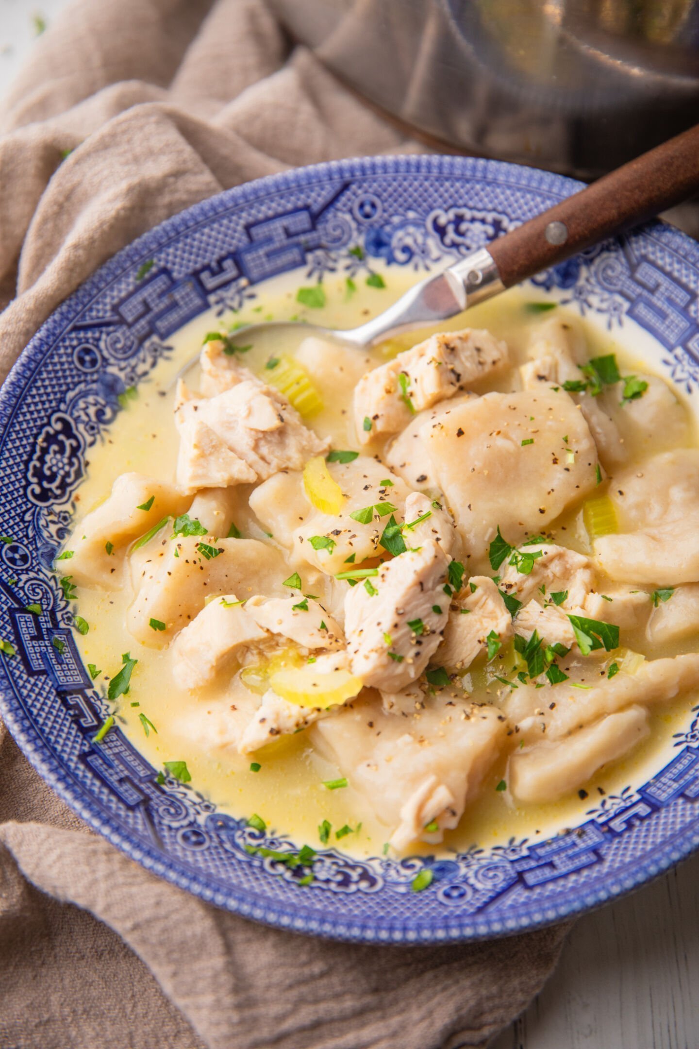 Scoop the soup and dumplings into serving bowls, season with salt and pepper, and chopped fresh parsley