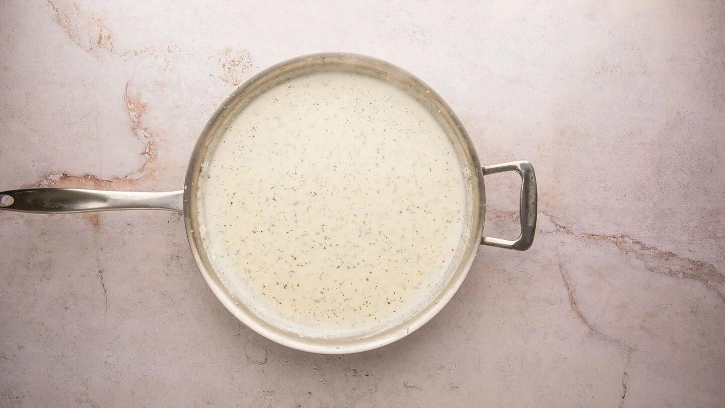 olive oil, garlic and flour in skillet